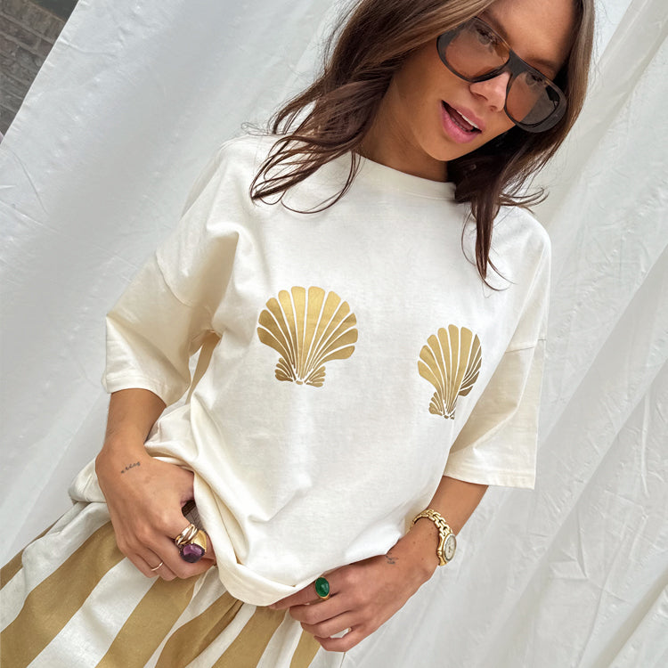 NEVER FULLY DRESSED Gold Shell Boob T-Shirt